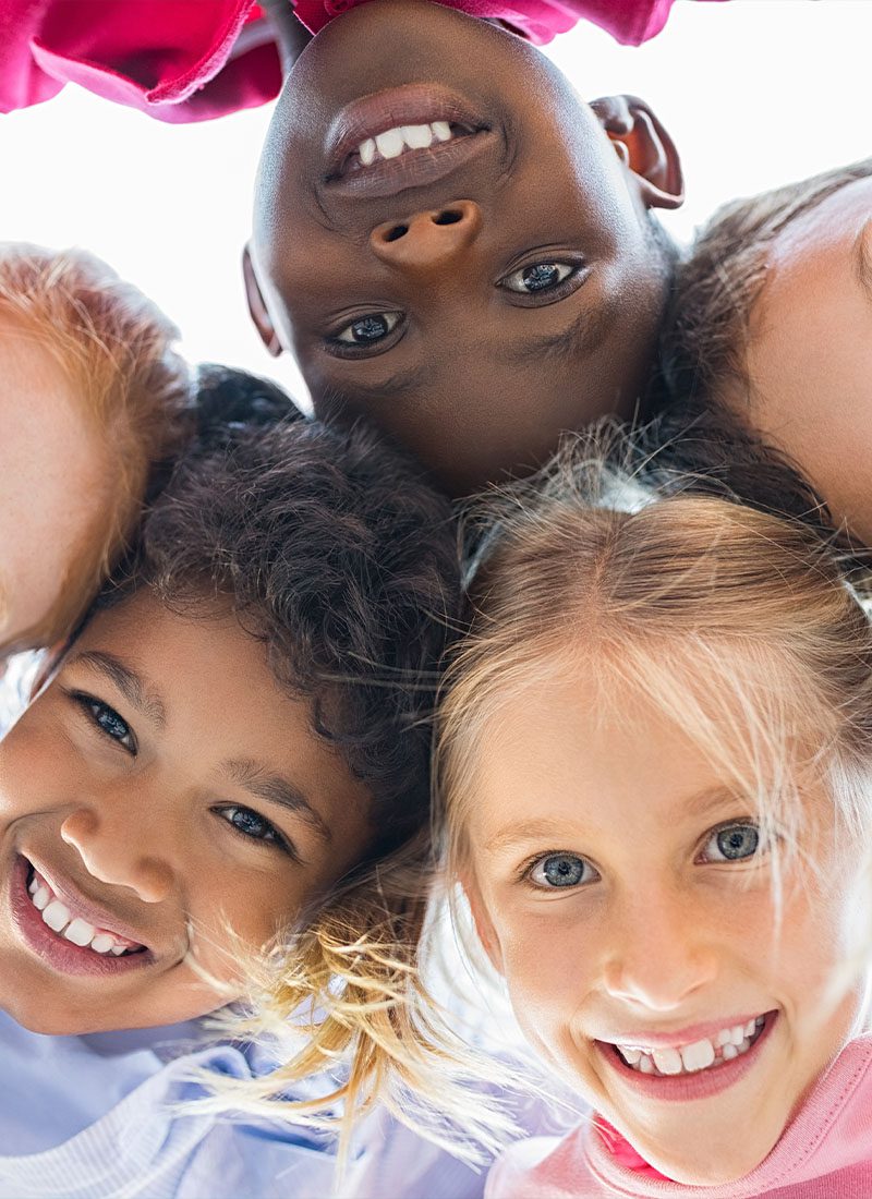 group of five children smiling together-v
